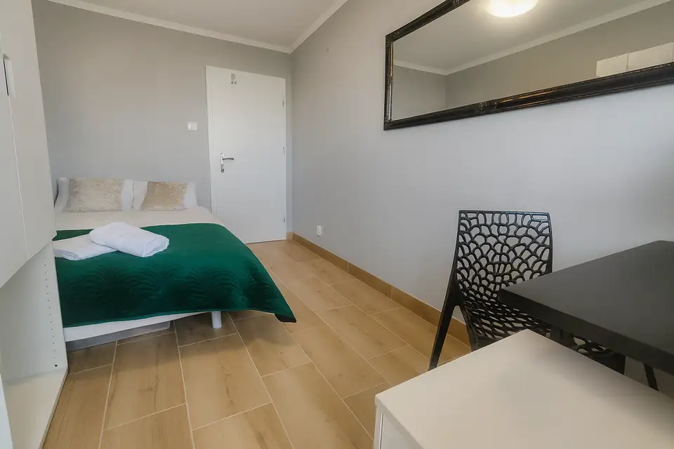 room in Wola 1